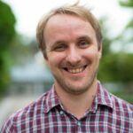 Head shot of happy man smiling outdoors